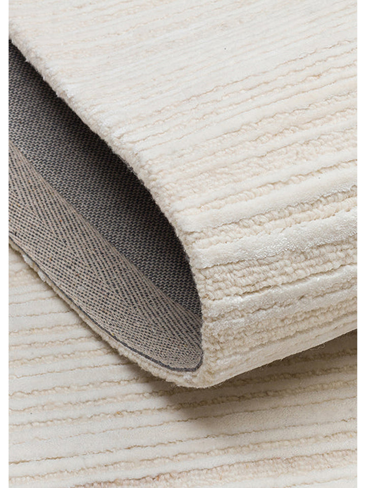 Tappeto tessuto a mano in misto lana e TENCEL™ della serie Palermo CREAM
